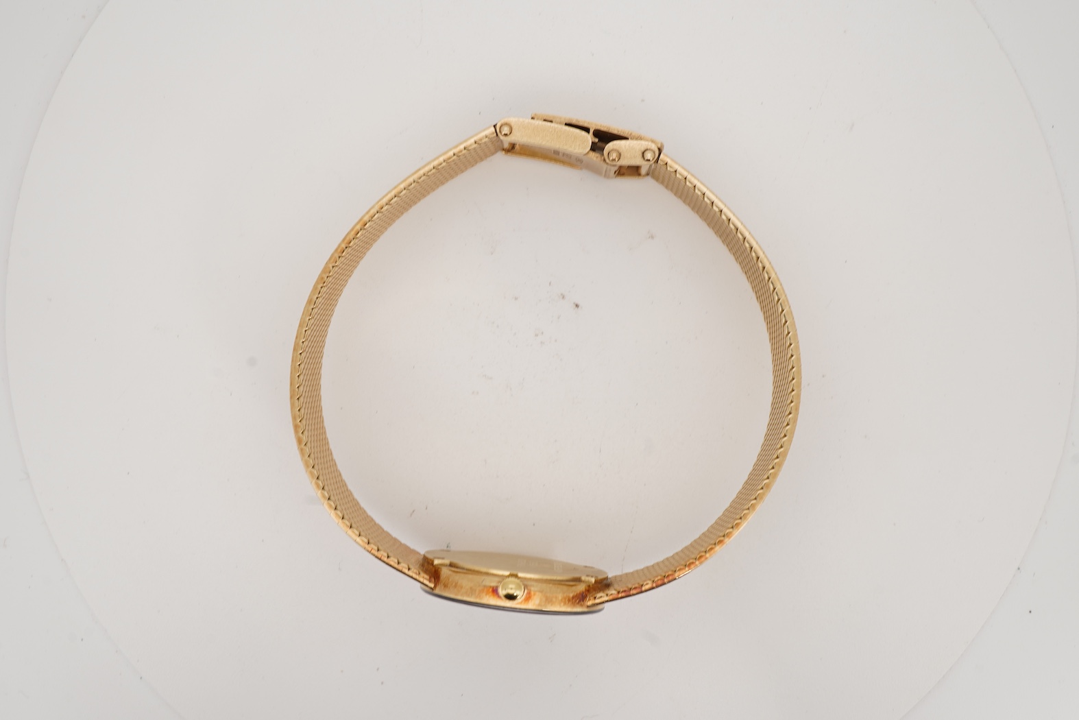 A lady's late 20th century Swiss Movado Museum 14k yellow metal quartz wrist watch, on an integral Italian 14k bracelet